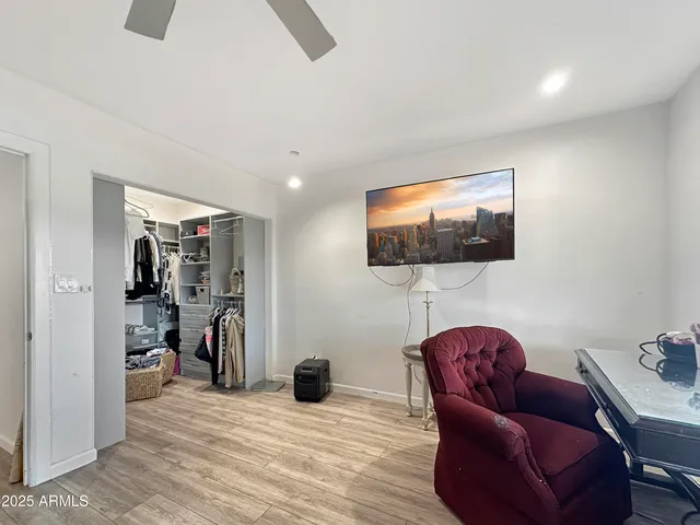 a view of a livingroom with furniture and a flat screen tv