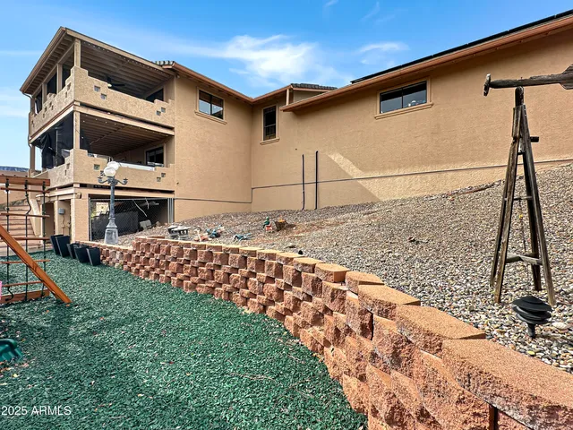 a view of a park with iron fence