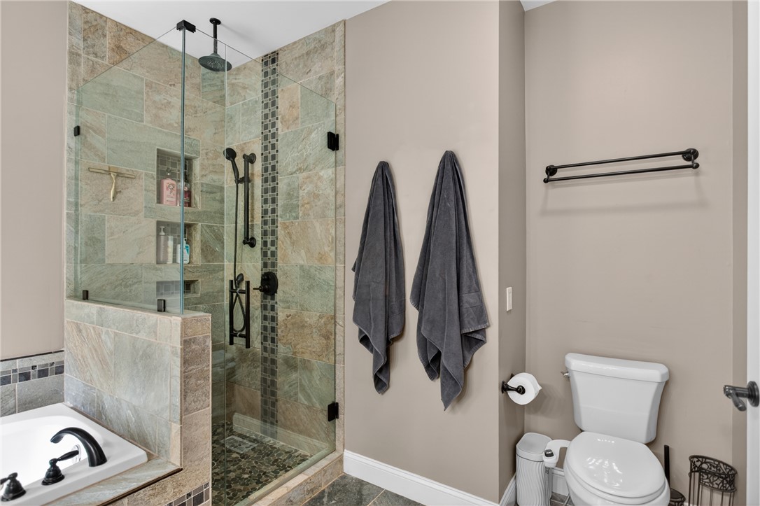 136 Loran Pointe Circle Seneca, SC 29672 - Photo 18 of 50 A revitalizing shower and a spacious tub offer a spa-like retreat in this bathroom.