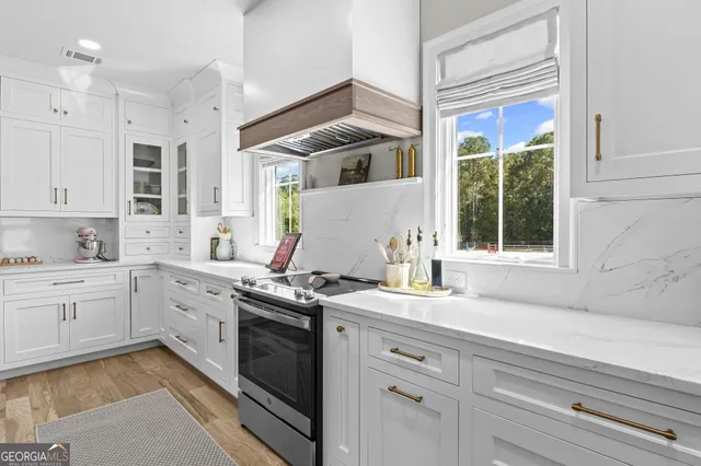 a view of a living room with furniture and a flat screen tv
