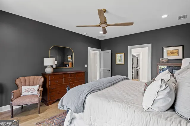 a view of an entryway with wooden floor