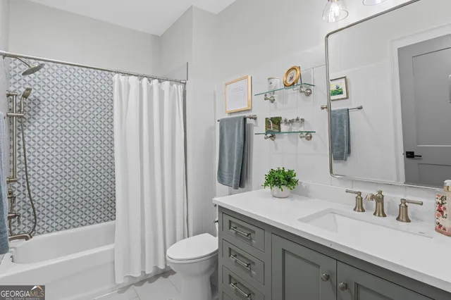 a view of a big house with a big yard and large trees