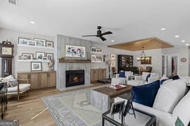 a living room with furniture or kitchen view and a rug