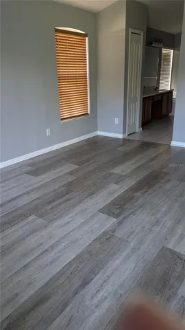 a view of room window and wooden floor