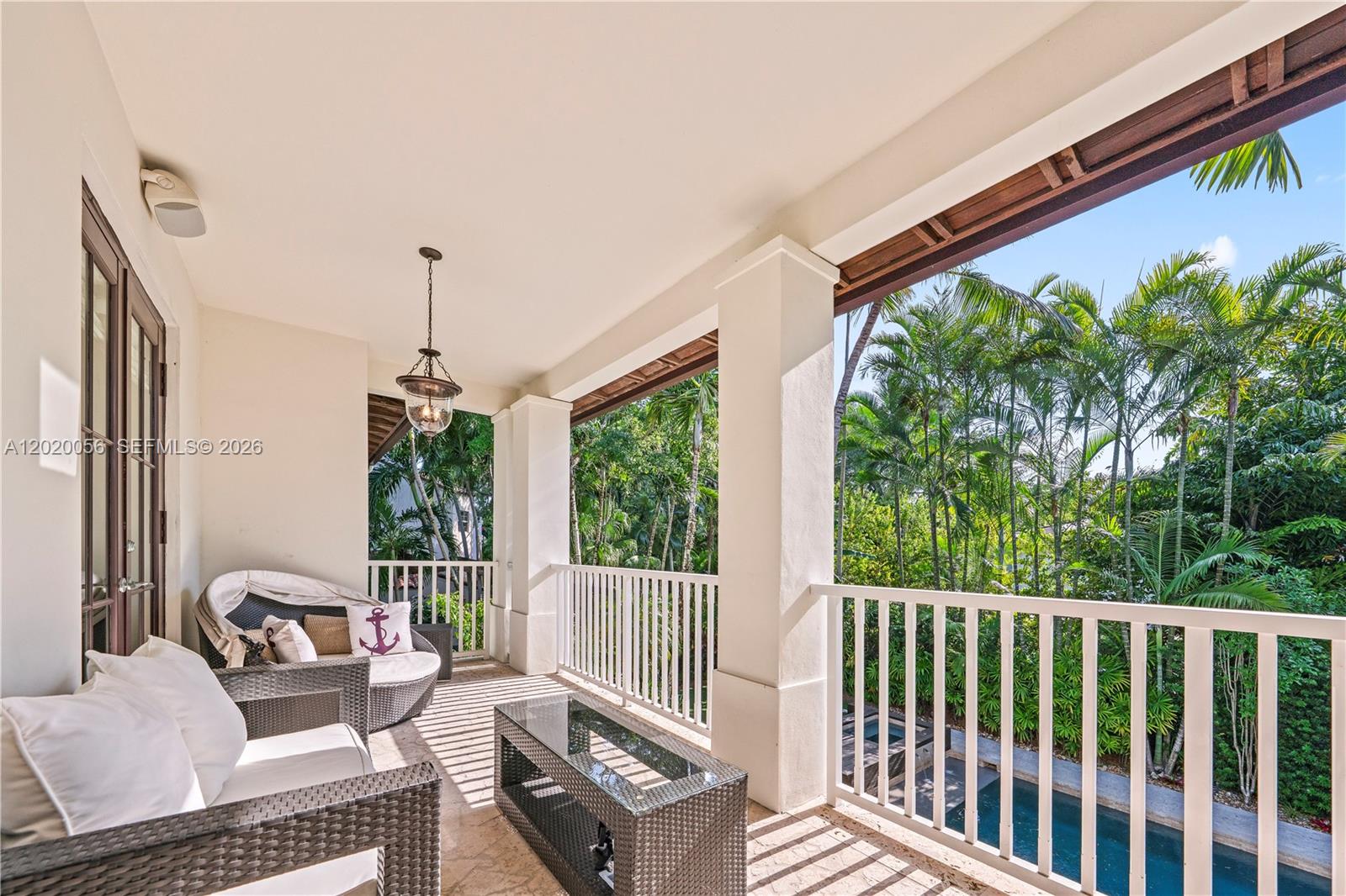 4196 Douglas Road Miami, FL 33133 - Photo 44 of 96 a balcony with furniture and a potted plant