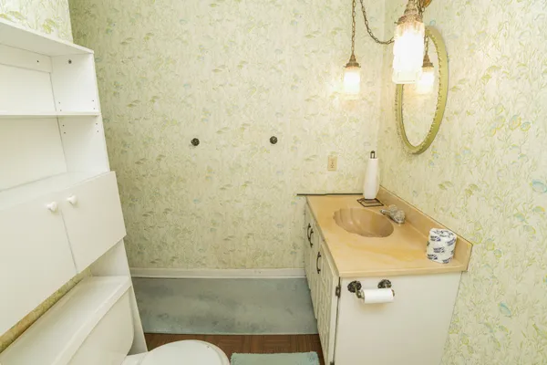 a bathroom with a sink and a mirror