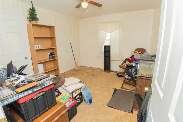 a bed room with a bed and a desk