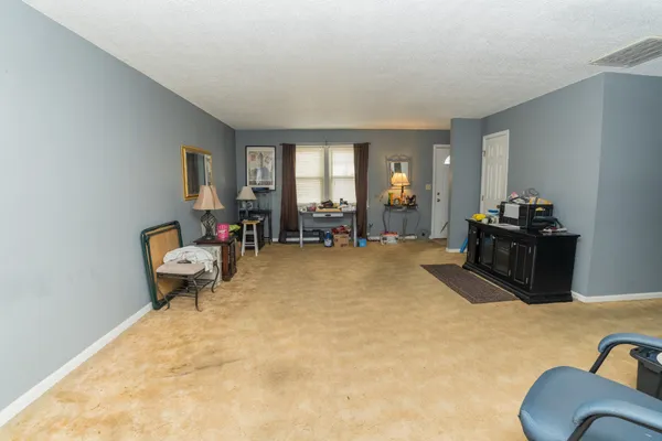 a living room with furniture window and a couch