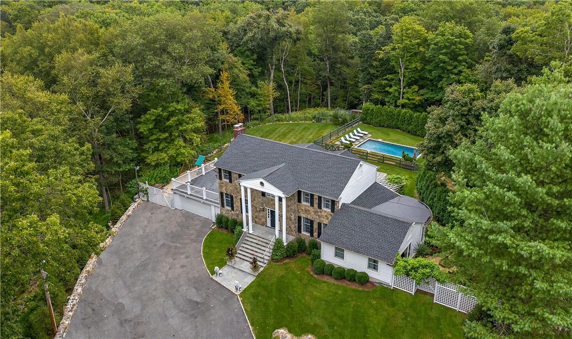 38 Saddle Ridge Road Pound Ridge, NY 10576 - Photo 1 of 1 an aerial view of a house with garden space and street view