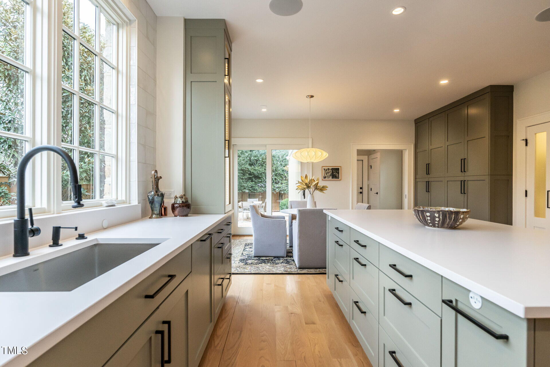 1610 St Marys Street Raleigh, NC 27608 - Photo 16 of 41 a large white kitchen with a large window and sink