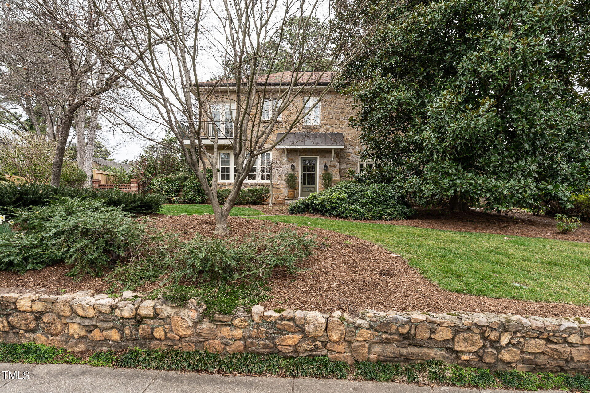1610 St Marys Street Raleigh, NC 27608 - Photo 2 of 41 a front view of a house with a yard and trees