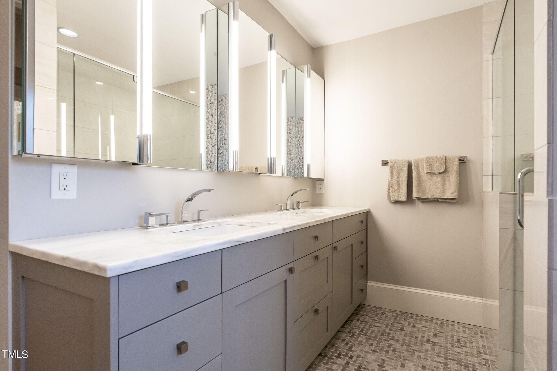 1610 St Marys Street Raleigh, NC 27608 - Photo 22 of 41 a bathroom with a sink and a mirror
