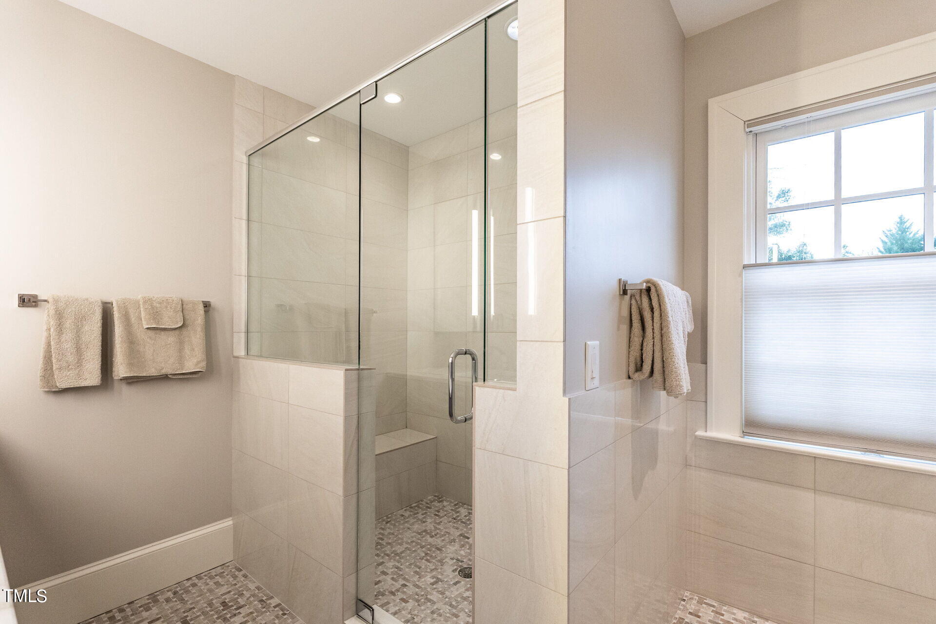 1610 St Marys Street Raleigh, NC 27608 - Photo 23 of 41 a bathroom with a shower and a sink