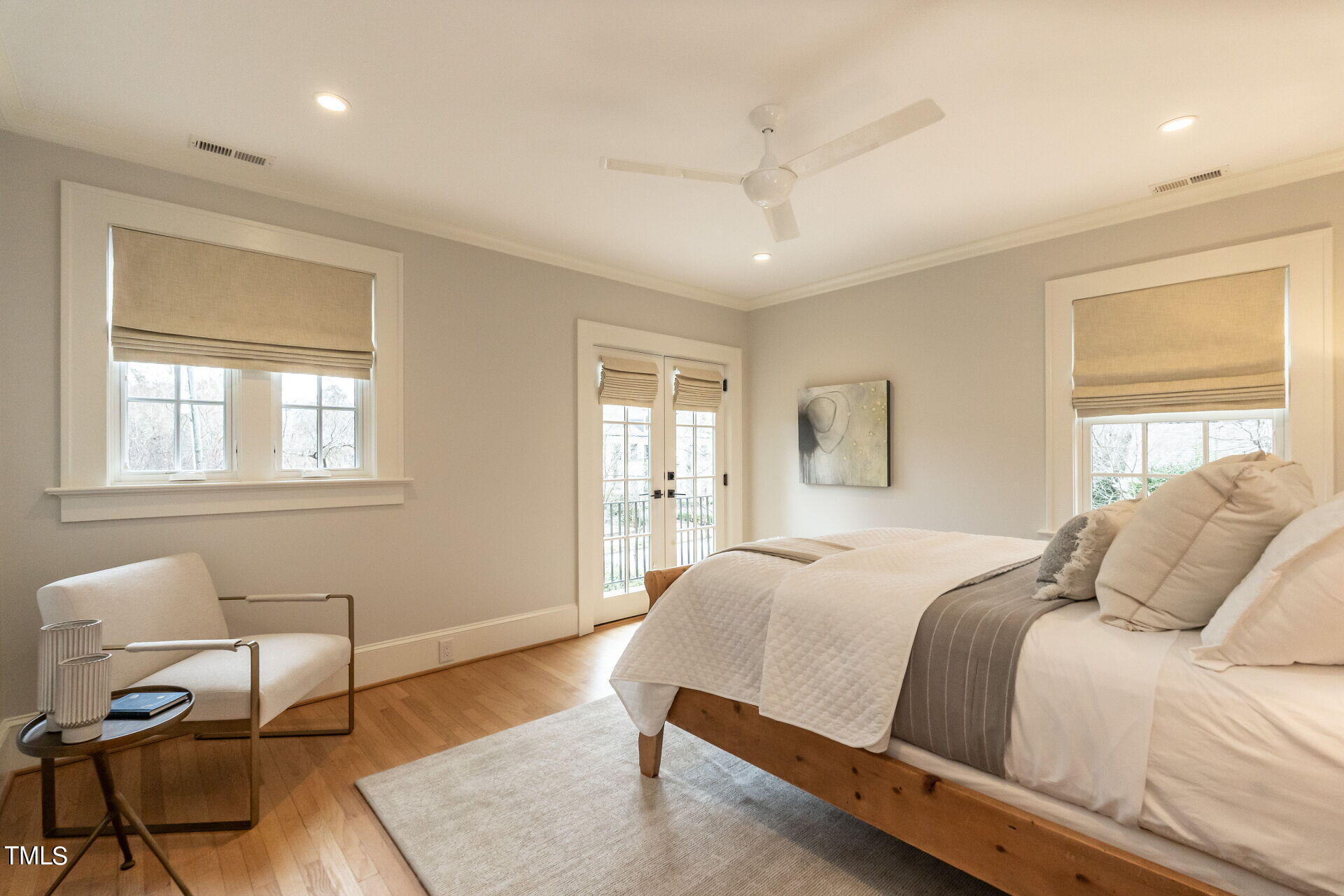 1610 St Marys Street Raleigh, NC 27608 - Photo 25 of 41 a bedroom with a large bed tv and a window
