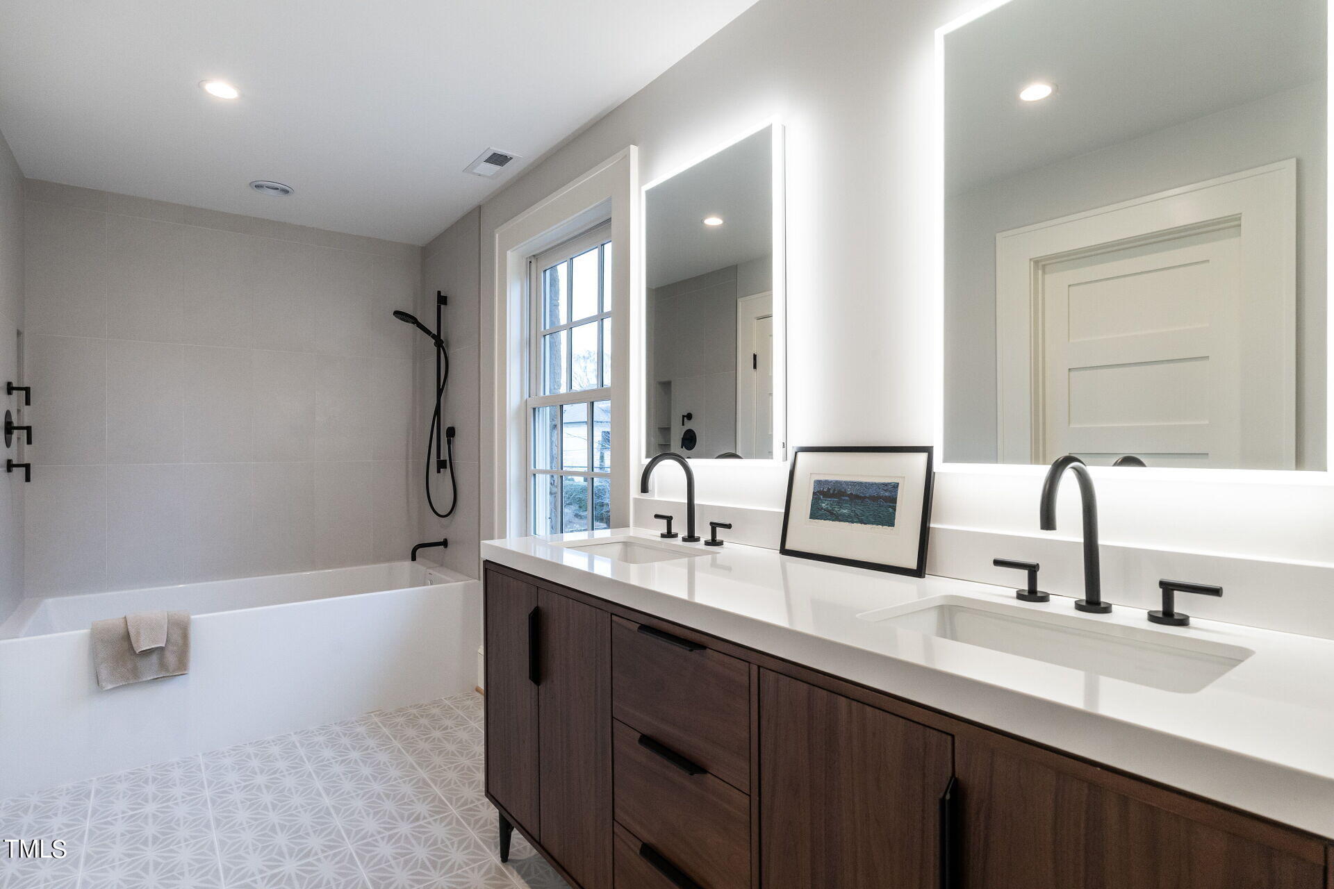 1610 St Marys Street Raleigh, NC 27608 - Photo 27 of 41 a bathroom with a double vanity sink mirror and