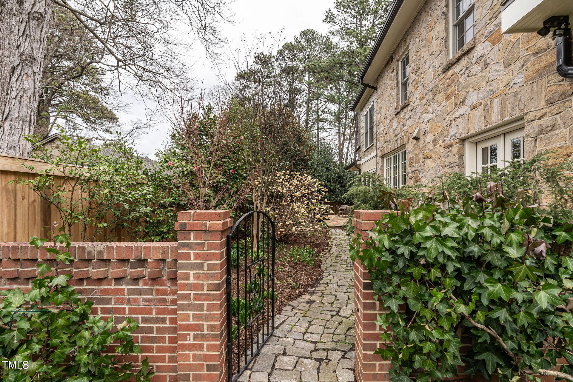 1610 St Marys Street Raleigh, NC 27608 - Photo 33 of 41 a backyard of a building with trees