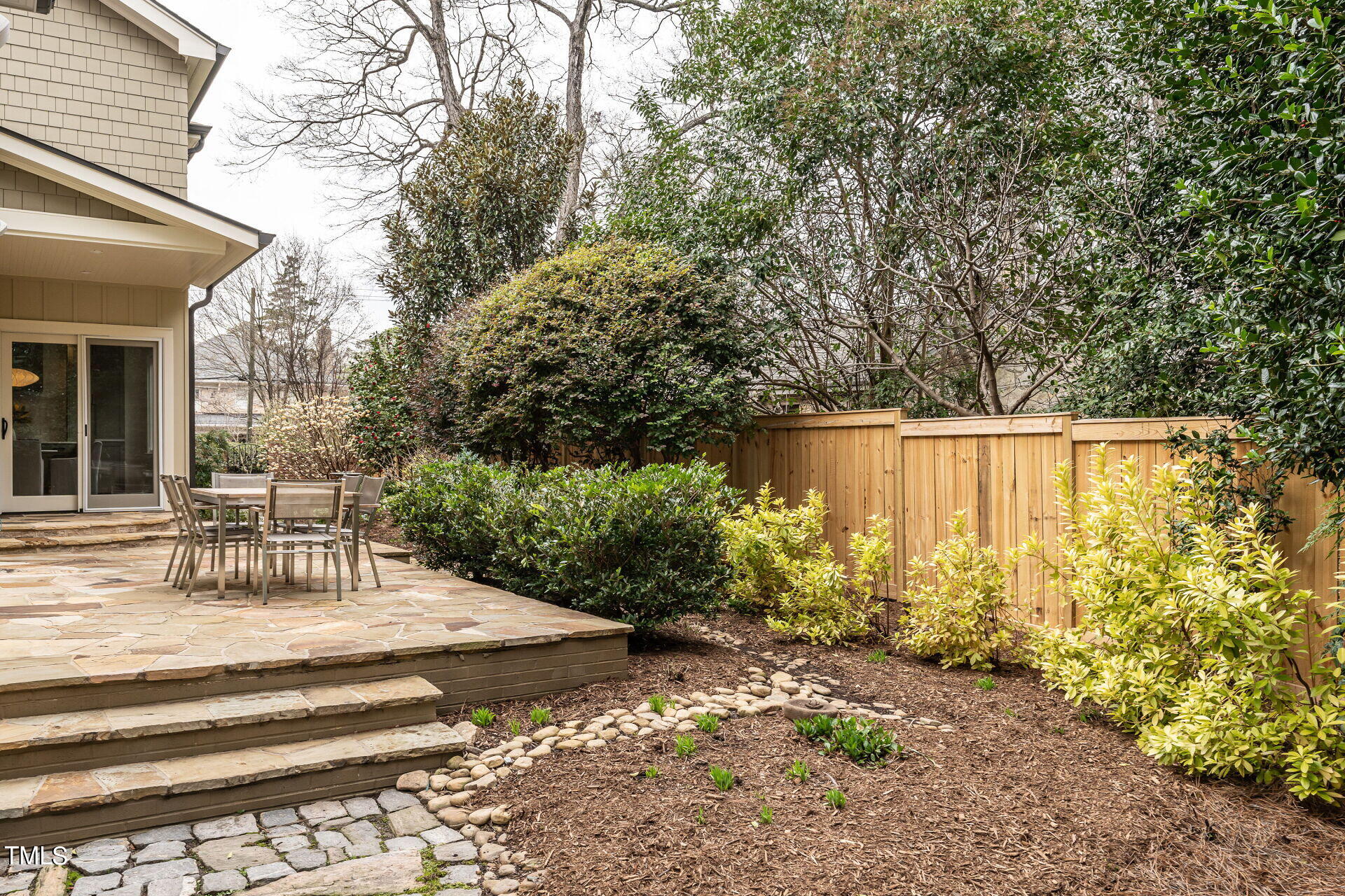 1610 St Marys Street Raleigh, NC 27608 - Photo 35 of 41 a view of backyard with outdoor seating and plants