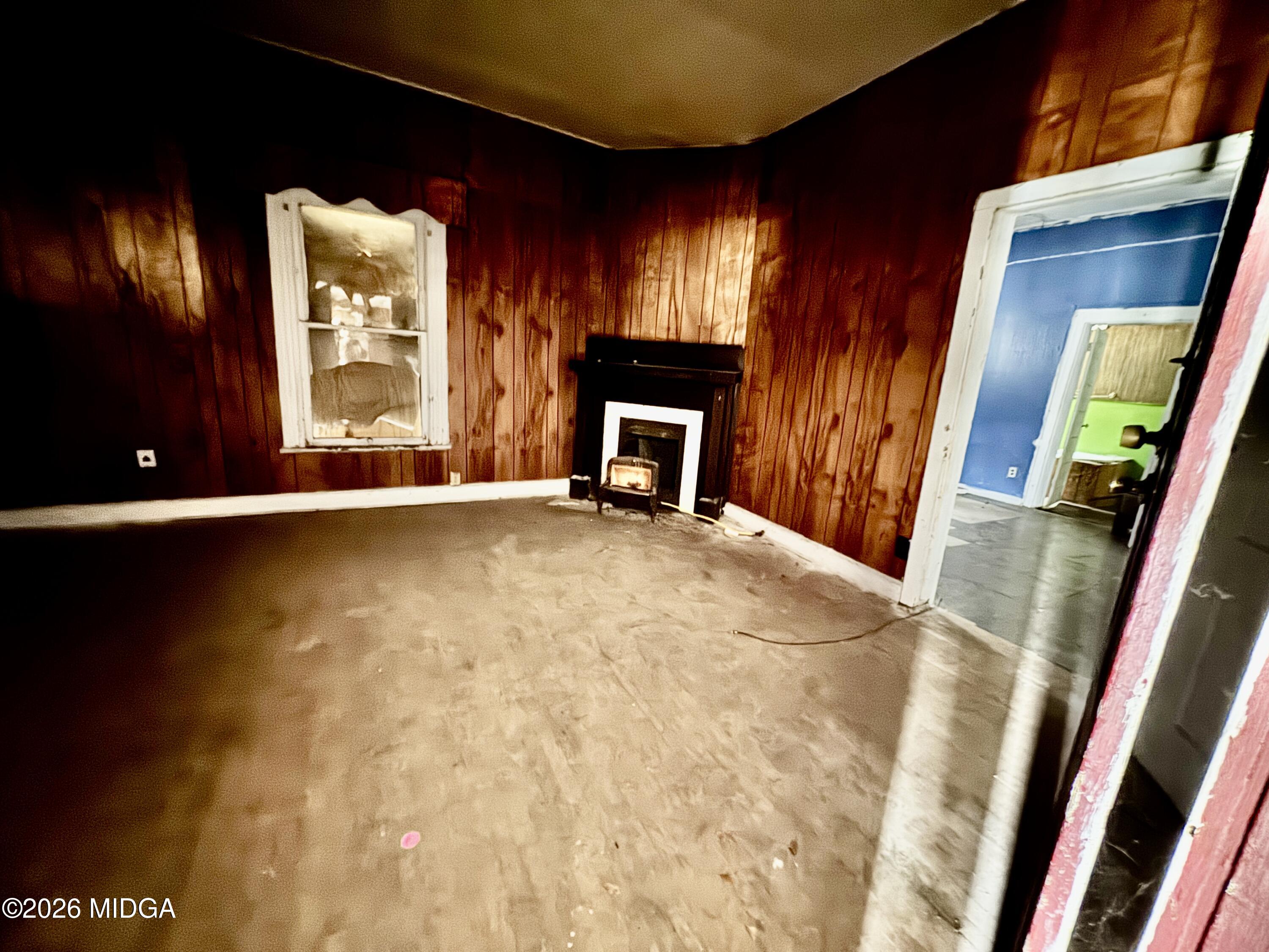 1905 3rd Avenue Macon, GA 31201 - Photo 6 of 27 a view of an empty room with a fireplace