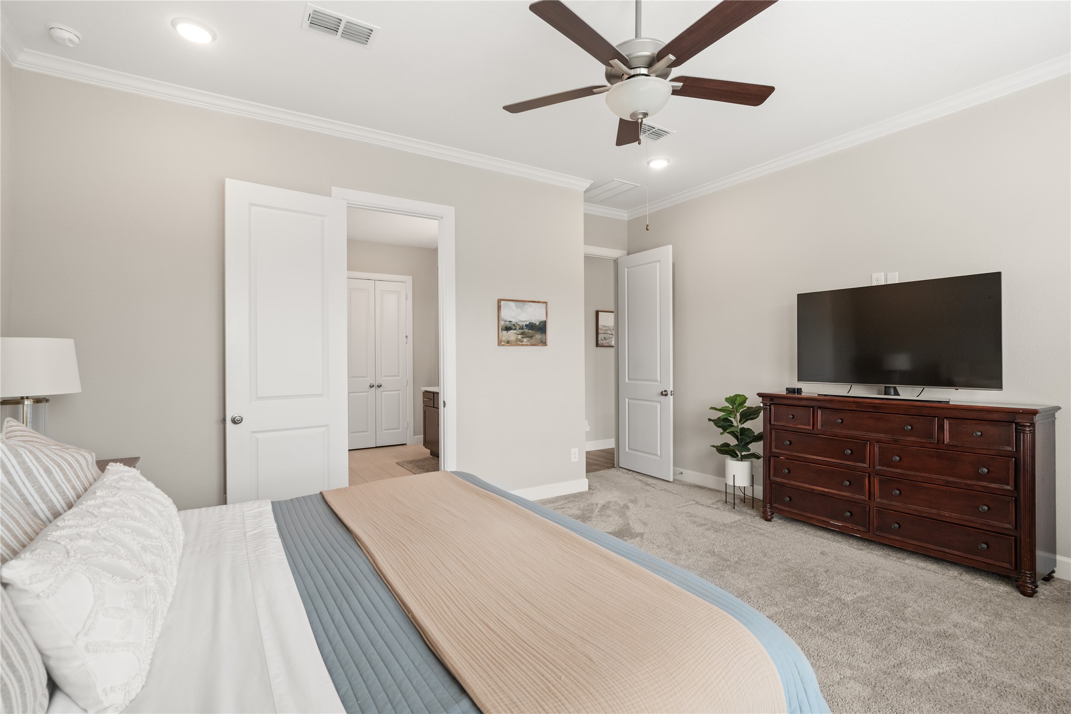 3118 Swift Way Katy, TX 77493 - Photo 18 of 34 Primary Bedroom (Alternate View) – Generously sized bedroom with direct access to the en-suite bathroom, designed for comfort and privacy.
