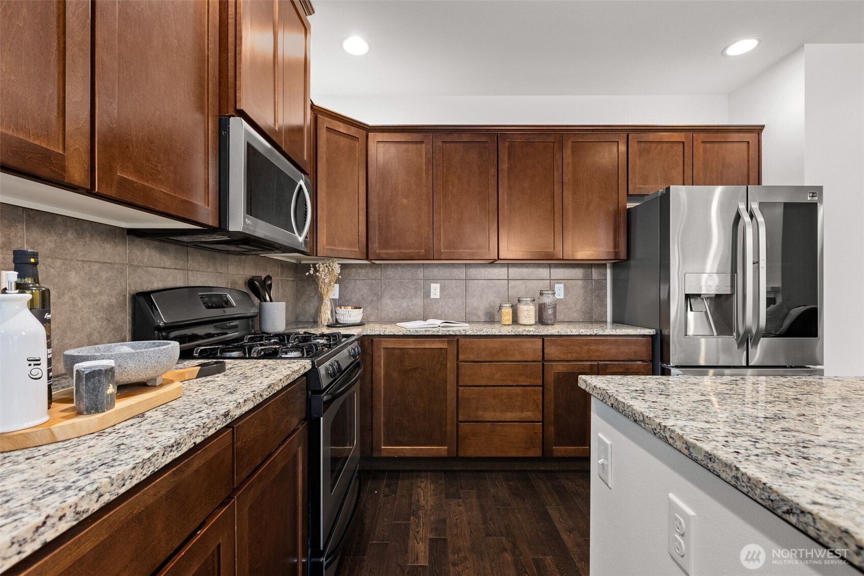 16516 2nd Park Southeast Bothell, WA 98012 - Photo 16 of 39 a kitchen with stainless steel appliances granite countertop a sink stove and refrigerator