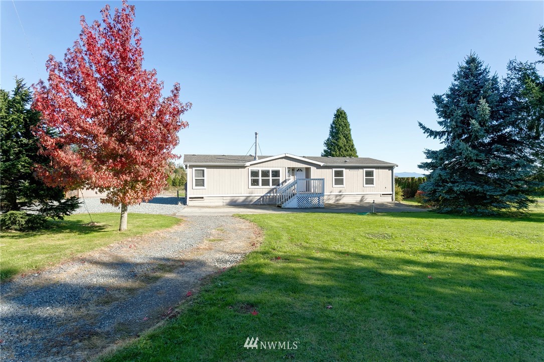 5998 Elder Road Ferndale, WA 98248 - Photo 1 of 23 a front view of a house with garden