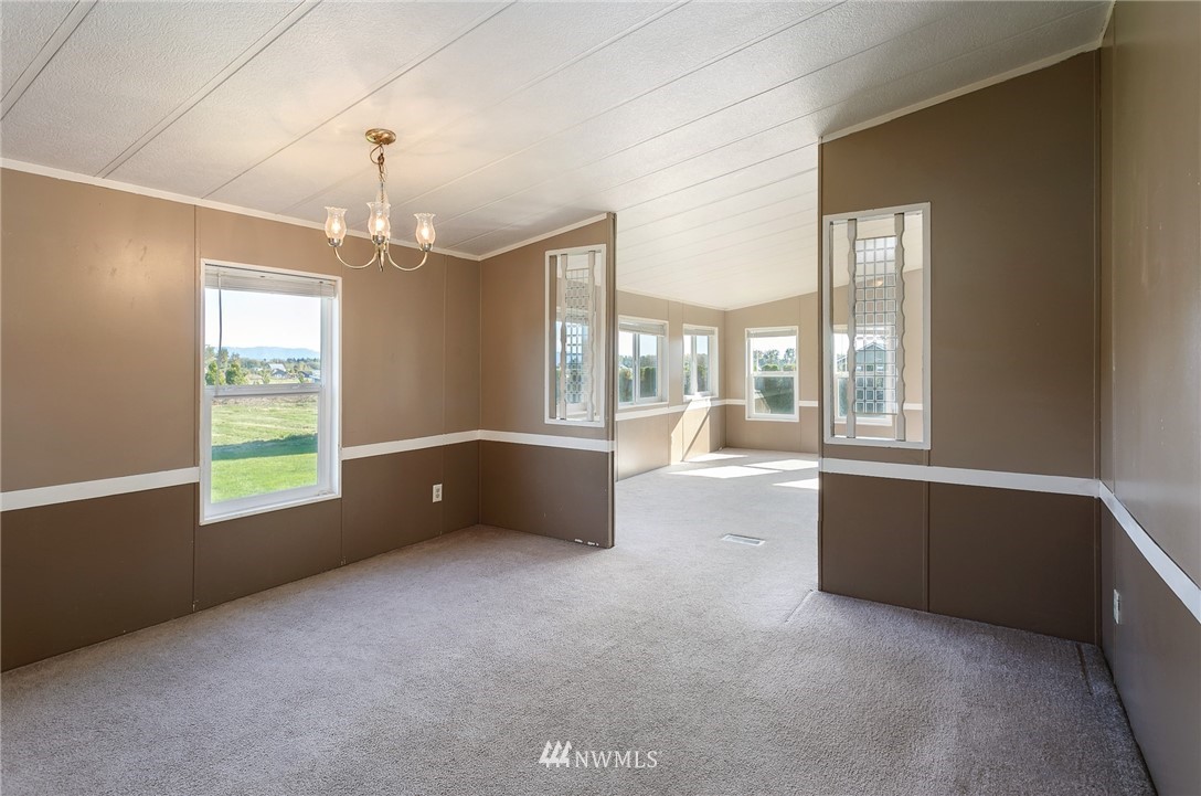 5998 Elder Road Ferndale, WA 98248 - Photo 11 of 23 a spacious bedroom with a large bed and a large window