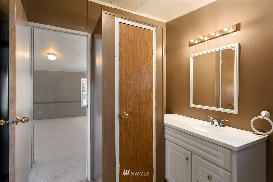 5998 Elder Road Ferndale, WA 98248 - Photo 14 of 23 a bathroom with a sink and a mirror