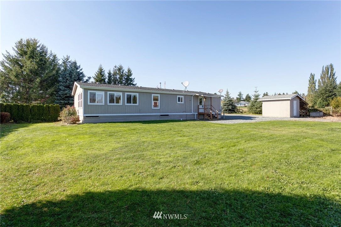 5998 Elder Road Ferndale, WA 98248 - Photo 17 of 23 a view of a house with a yard and a porch