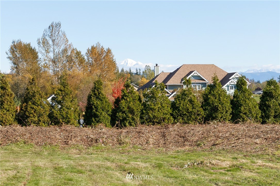 5998 Elder Road Ferndale, WA 98248 - Photo 20 of 23 a view of a lake with a house in background