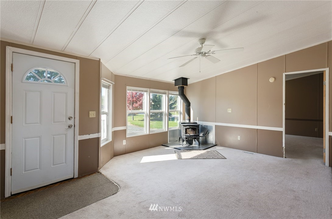 5998 Elder Road Ferndale, WA 98248 - Photo 3 of 23 wooden floor in an empty room with a window