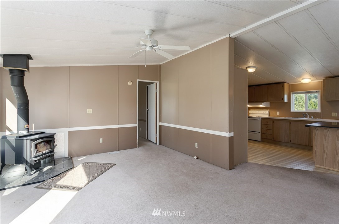 5998 Elder Road Ferndale, WA 98248 - Photo 4 of 23 a view of a kitchen with a sink and a fireplace