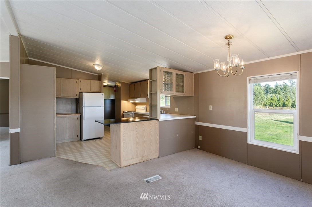 5998 Elder Road Ferndale, WA 98248 - Photo 7 of 23 a kitchen with refrigerator and window
