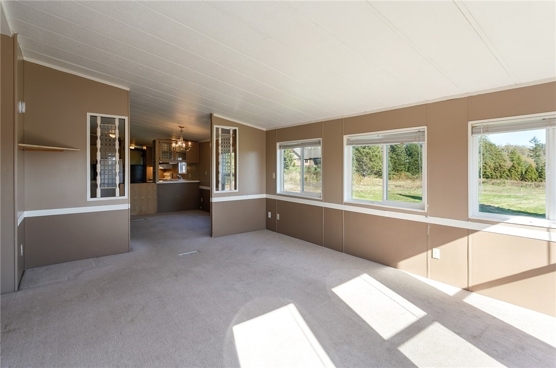 5998 Elder Road Ferndale, WA 98248 - Photo 8 of 23 a living room with furniture and large windows