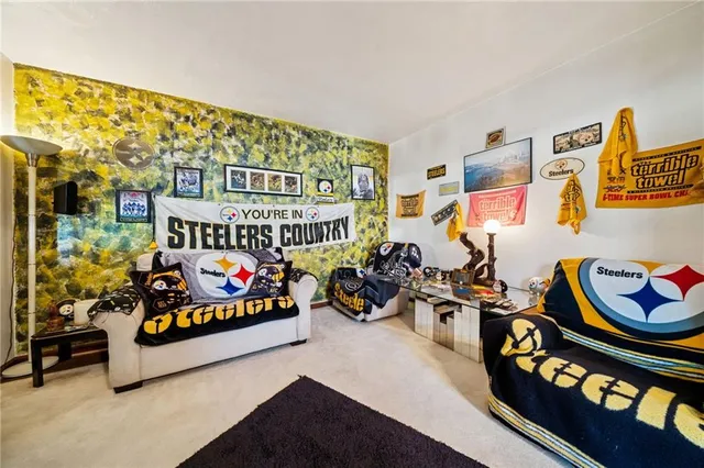 a bedroom with bed and a couch