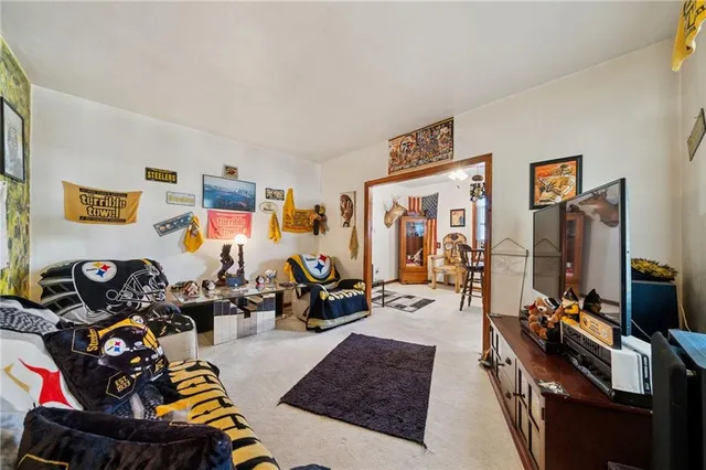 a living room with furniture window and a flat screen tv