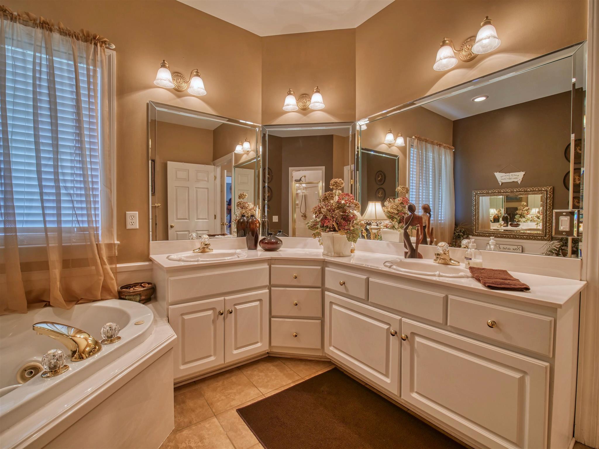 1654 Berea Church Road Lebanon, TN 37087 - Photo 11 of 30 a spacious bathroom with a sink a large mirror and a bathtub