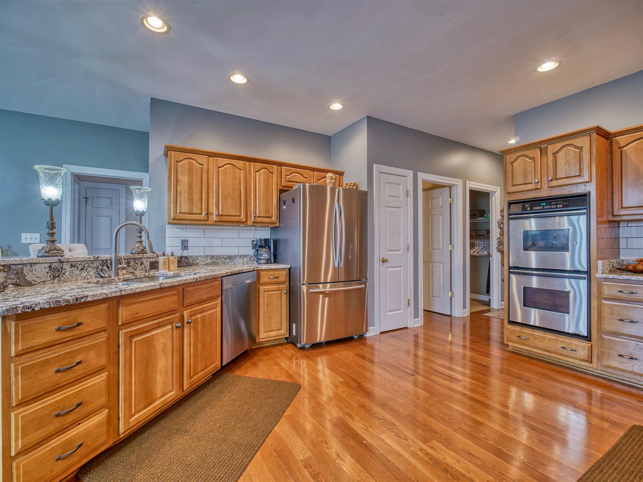 1654 Berea Church Road Lebanon, TN 37087 - Photo 6 of 30 a kitchen with stainless steel appliances granite countertop a refrigerator and a stove top oven