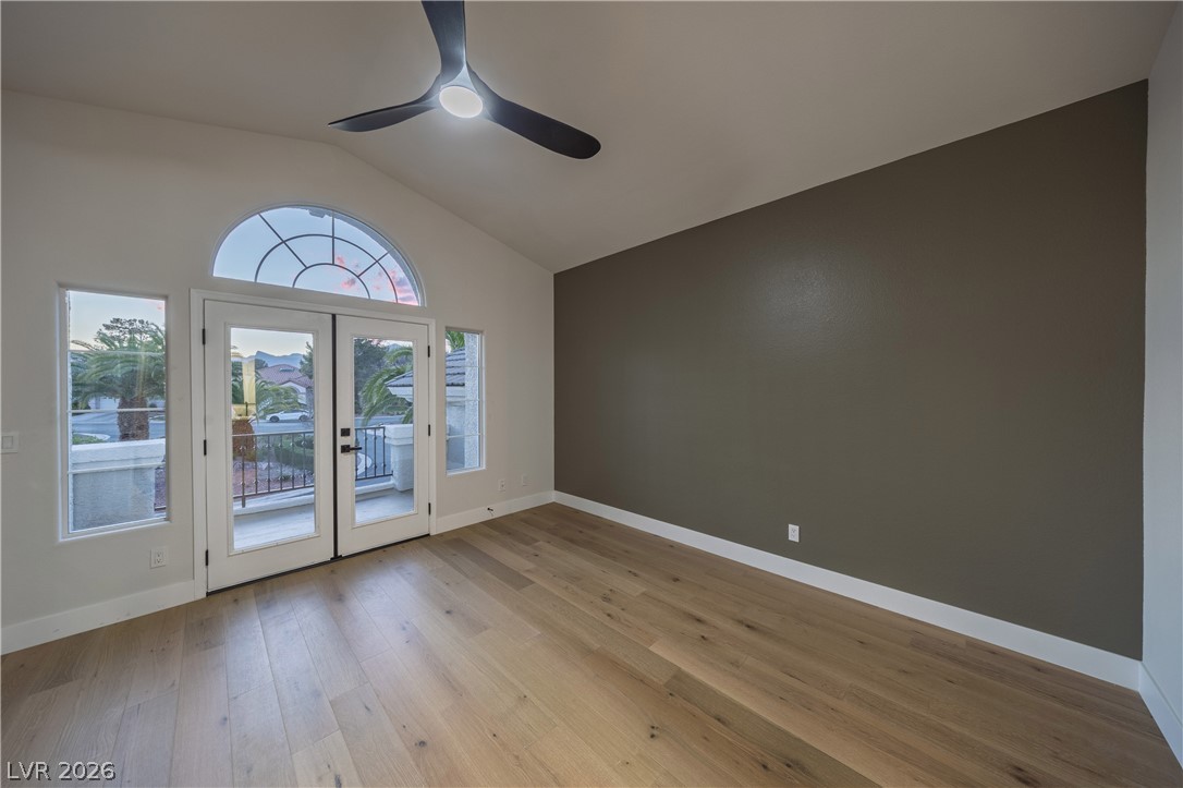 8800 Lusso Las Vegas, NV 89134 - Photo 64 of 85 Doorway to outside with french doors, ceiling fan, hardwood / wood-style floors, and lofted ceiling