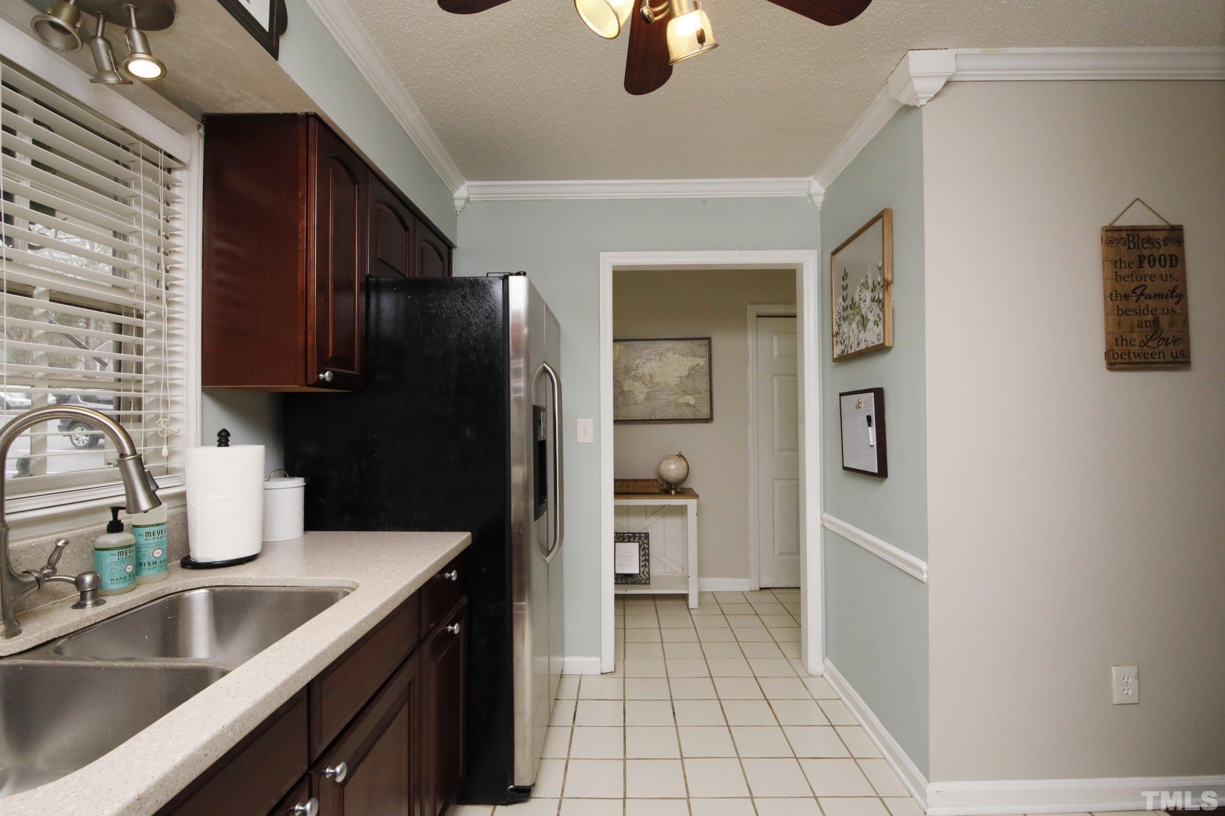 116 Long Shadow Place Durham, NC 27713 - Photo 13 of 38 a kitchen with stainless steel appliances granite countertop a refrigerator and a sink