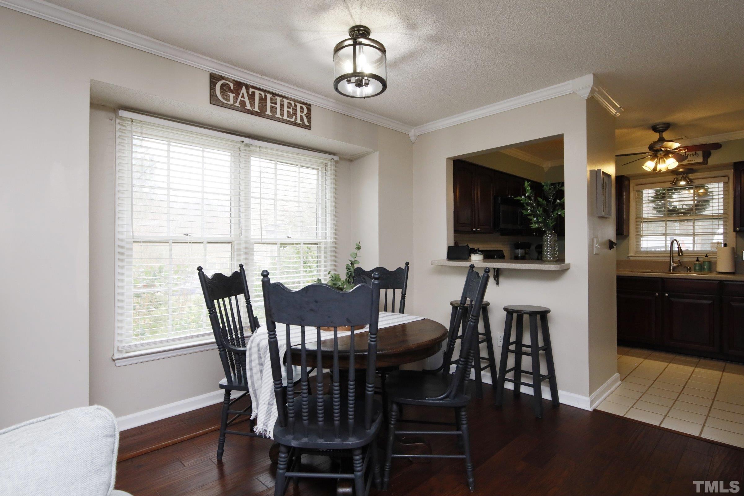 116 Long Shadow Place Durham, NC 27713 - Photo 14 of 38 a view of a dining room with furniture window and wooden floor
