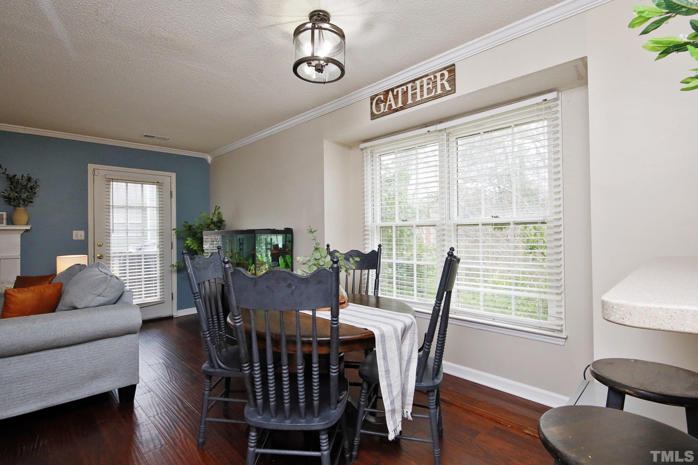 116 Long Shadow Place Durham, NC 27713 - Photo 15 of 38 a view of a dining room with furniture window and wooden floor