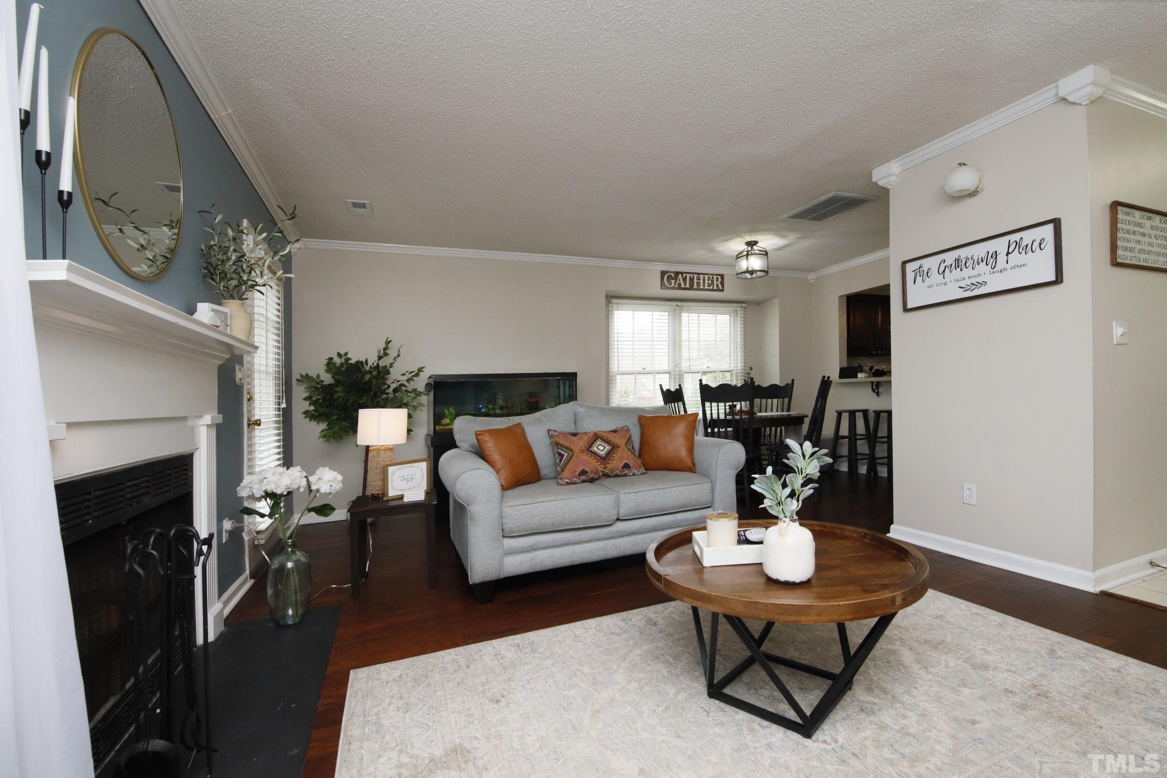 116 Long Shadow Place Durham, NC 27713 - Photo 17 of 38 a living room with furniture and a fireplace
