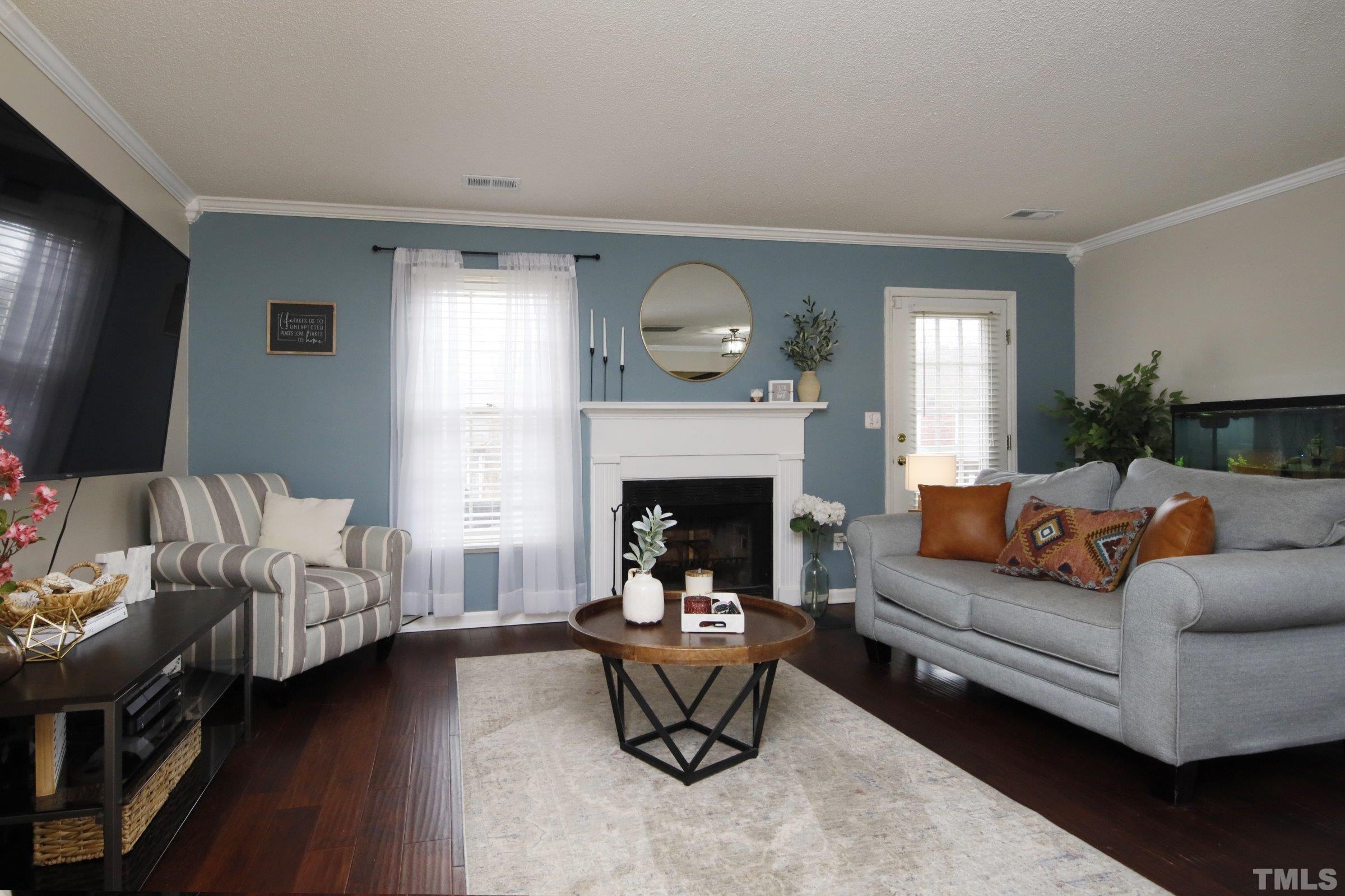 116 Long Shadow Place Durham, NC 27713 - Photo 19 of 38 a living room with furniture and a fireplace