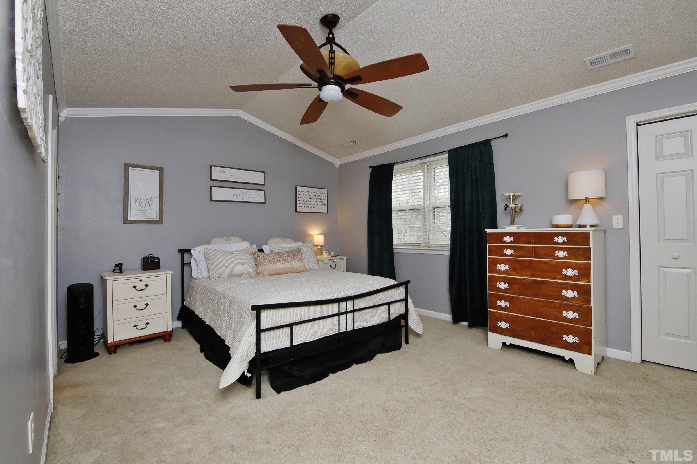 116 Long Shadow Place Durham, NC 27713 - Photo 25 of 38 a bedroom with a bed and a ceiling fan