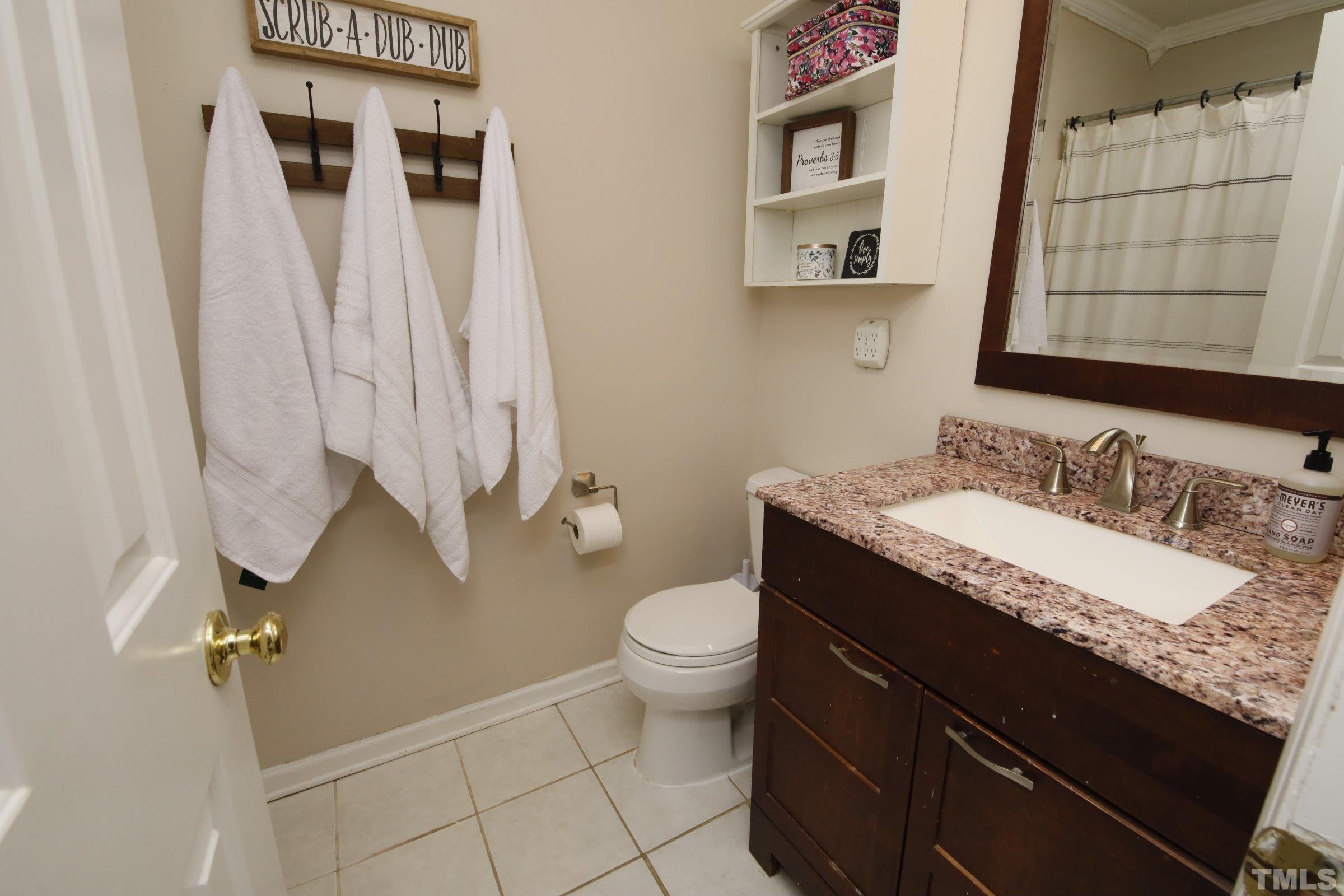 116 Long Shadow Place Durham, NC 27713 - Photo 27 of 38 a bathroom with a granite countertop sink toilet and shower