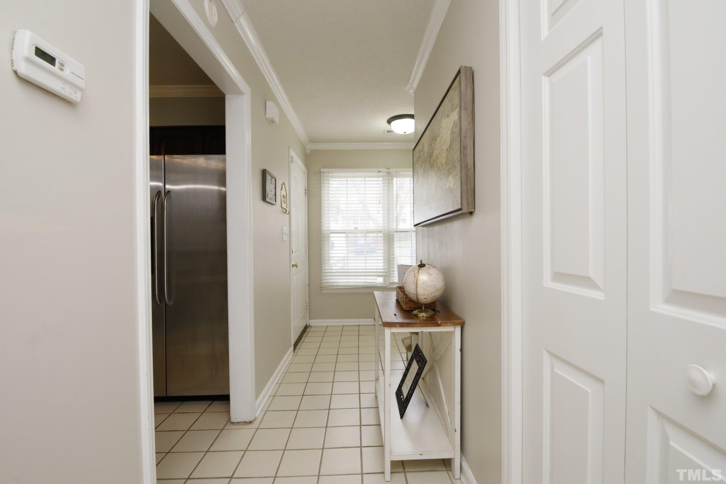 116 Long Shadow Place Durham, NC 27713 - Photo 6 of 38 a walk in closet with wooden floor and a window
