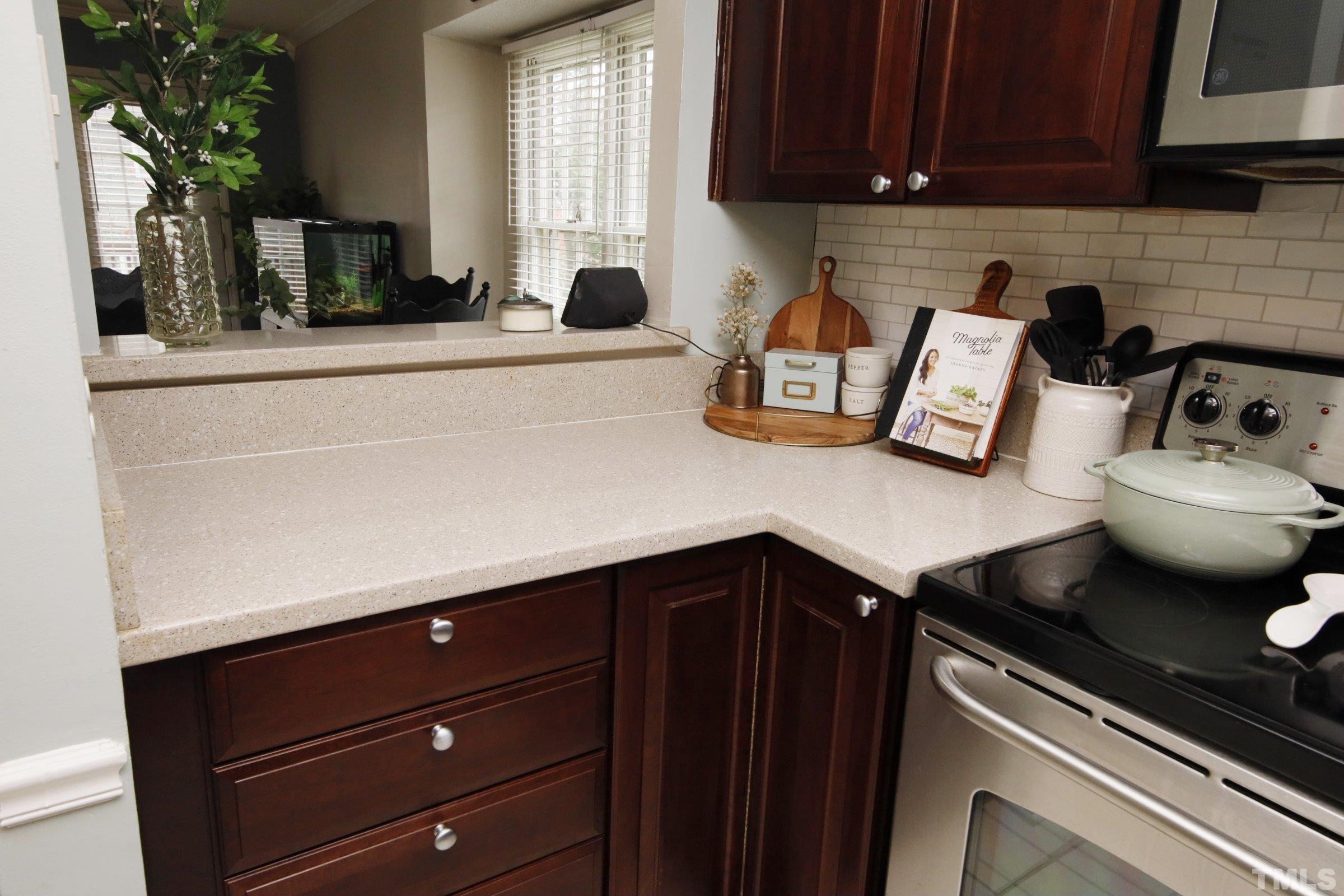 116 Long Shadow Place Durham, NC 27713 - Photo 9 of 38 a kitchen with a sink and cabinets