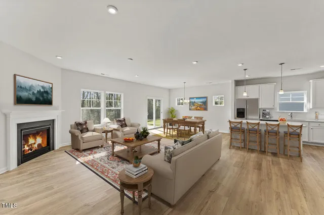 a living room with furniture fireplace and window
