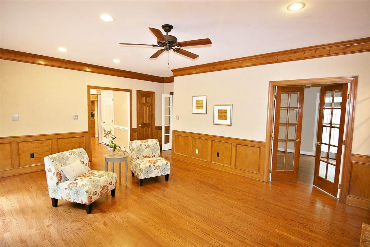 2001 Countrywood Road North Raleigh, NC 27615 - Photo 9 of 25 Family room features warm wood wainscoting Family Room
