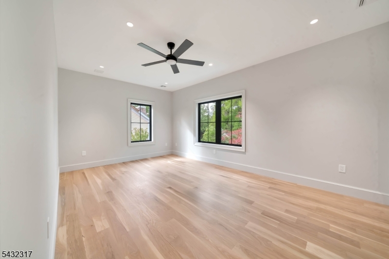 266 Brooklake Road Florham Park, NJ 07932 - Photo 29 of 50 wooden floor in an empty room with a window